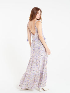Long dress.  • Round neck.  • Strips with decorative tassels.